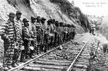 Chain gang near Asheville, 1915. Postcard image. Text in upper right reads "Stripes but no Stars" (Image from North Carolina Office of Archives and History)