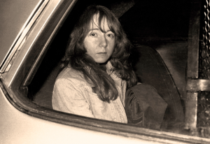Lynette "Squeaky" Fromme in transit to her assassination trial (1975) (source: syracuse.com)