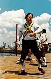 Jerry Epstein dancing with the Greenwich Morris Men on the docks of Ocean Beach in Fire Island, New York