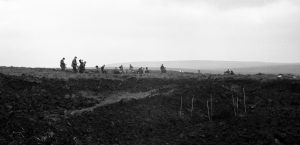 Police search Saddleworth Moor; upright stakes (right front) mark the burial site of victim Lesley Ann Downey (1965) (unsourced news photo; murderpedia.org)